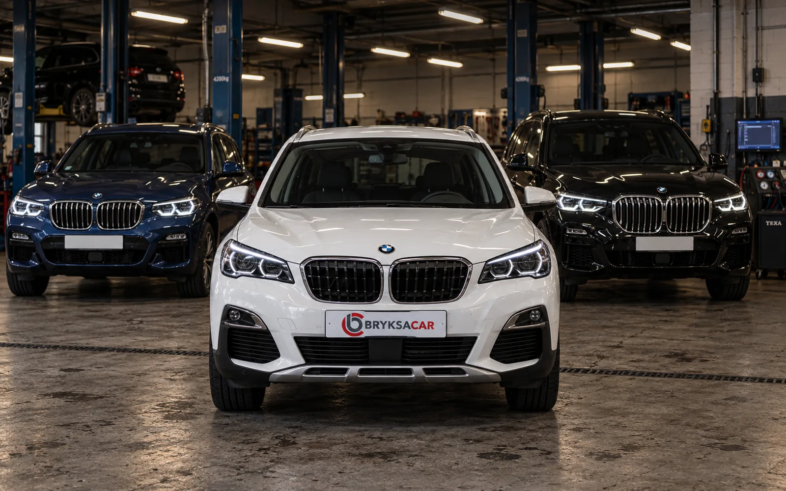 BMW X1, X3 i X5 w hali warsztatu